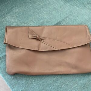 Mauve leather clutch.